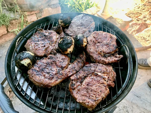 Entrecote Meat Cooking on Barbecue with Onions. — Stock Photo, Image