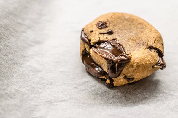 Paleo Chocolate Chip Cookies Made with Coconut and Almond Flour on Baking Sheet / Paper. Organic Food with Melted Chocolate. — Stock Photo, Image