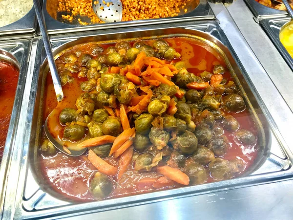 Local Turkish Restaurant Style Healthy Organic Vegan Vegetarian Hot Brussel Sprouts Food with Carrots and Tomato Paste. Ready to Eat.