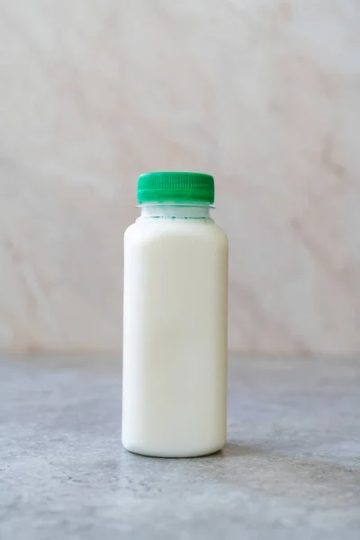 Take Away Authentic Indian Cold Drink Made up of Curd and Milk called Lassie / Lassi Kefir in Plastic Bottle. Ready to Eat.