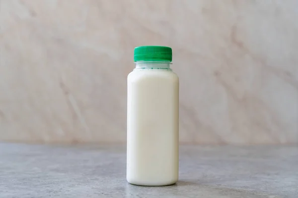 Take Away Authentic Indian Cold Drink Made up of Curd and Milk called Lassie / Lassi Kefir in Plastic Bottle. Ready to Eat.