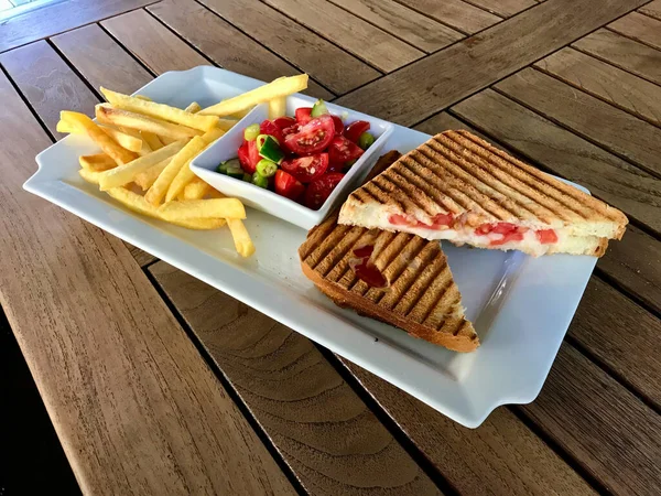Turkish Fast Food Menu Toast with Salad and Potatoes / Club Sandwich Tost on Wooden Table. Ready to Eat.