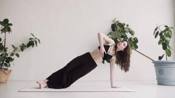 Young girl doing yoga. Sports activities at home — Stock Video