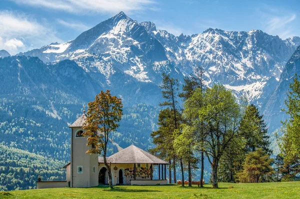 Small Church on the background of the Alps