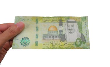 hand holding saudi riyal banknote 50 currency