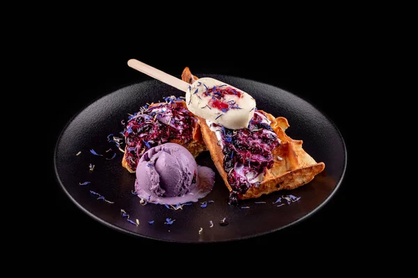 Belgian waffles with ice cream and flower petals