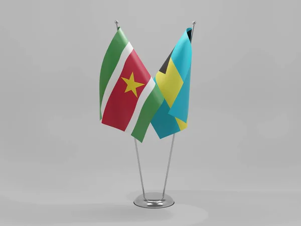 Bahamas Bandeiras Cooperação Suriname Fundo Branco Render — Fotografia de Stock