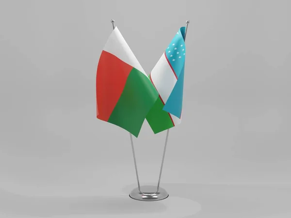Uzbekistán Banderas Cooperación Madagascar Fondo Blanco Render —  Fotos de Stock