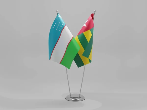 Togo Banderas Cooperación Uzbekistán Fondo Blanco Render —  Fotos de Stock