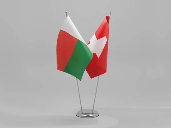 Suíça Bandeiras Cooperação Madagascar Fundo Branco Render — Fotografia de Stock