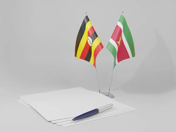 Suriname Bandeiras Acordo Uganda Fundo Branco Render — Fotografia de Stock