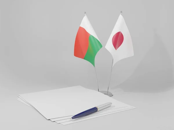 Japão Bandeiras Acordo Madagascar Fundo Branco Render — Fotografia de Stock