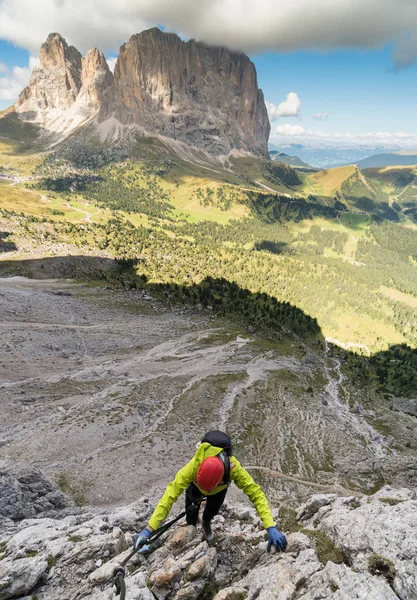 young attractive female mountain climber in the Dolomites of italy with a great  view