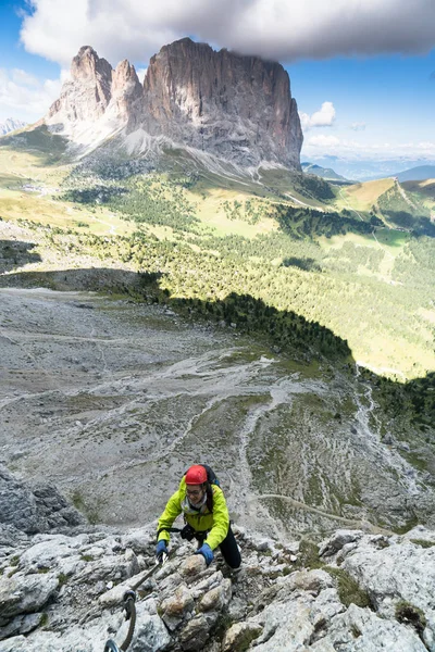 young attractive female mountain climber in the Dolomites of italy with a great  view