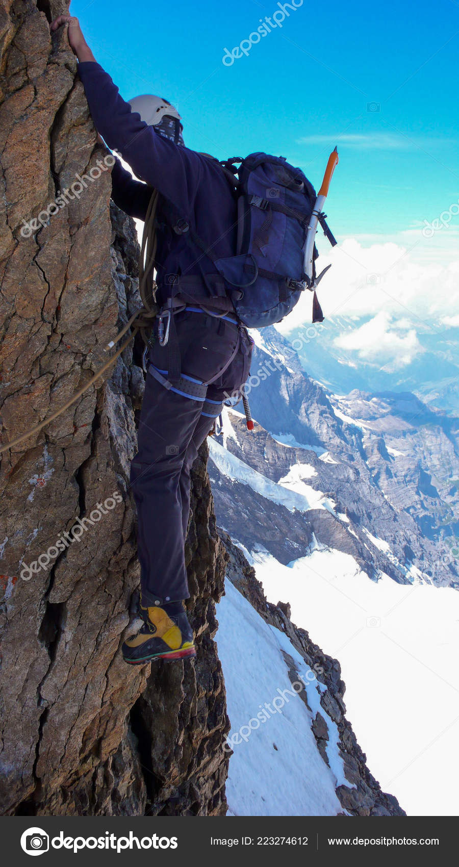 Extreme Mountain Climber Exposed Vertical Rock Snow Face His Way Stock Photo Image By C Makasanaphoto