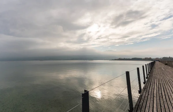 Long Wooden Boardwalk Pier Water Mountain Landscape Overcast Sky — Stock Photo, Image