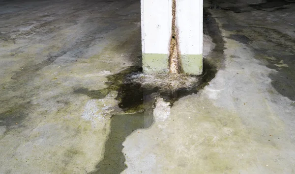 water damage in concrete construction with calcium and rust depo