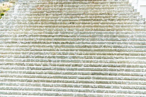 Abstract view of an artsy water fountain pyramid with water flow — Stock Photo, Image