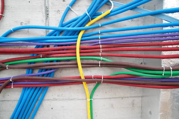 colorful plastic tubes for electrical wires in the sub ceiling i
