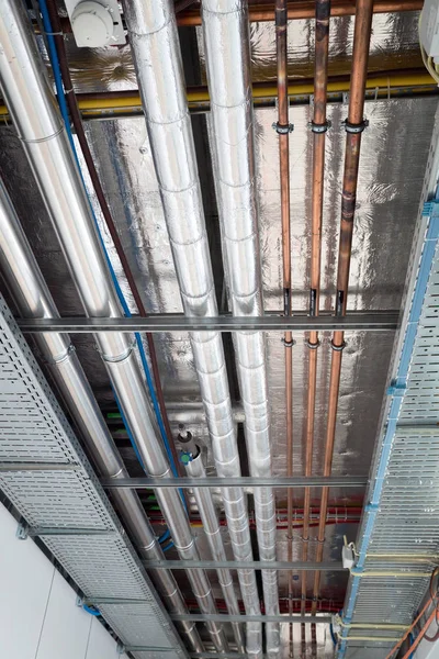 insulates hot water pipes and copper pipes hang from the subceil