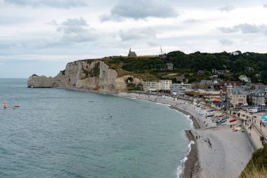 view of the rocky beach and seaside resort town of Etretat in No