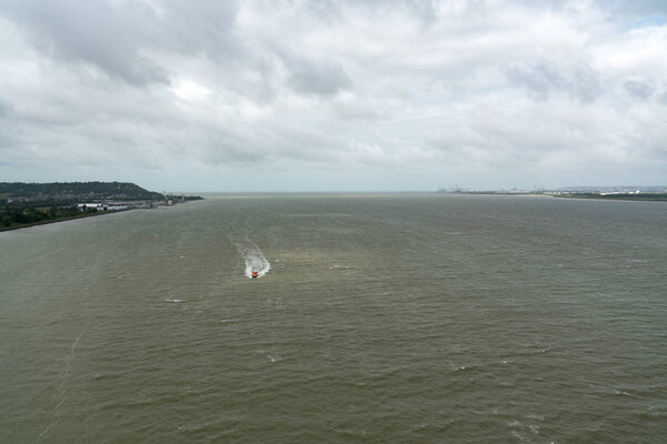 boat entering the Seine estuary from the English Channel in Le Havre