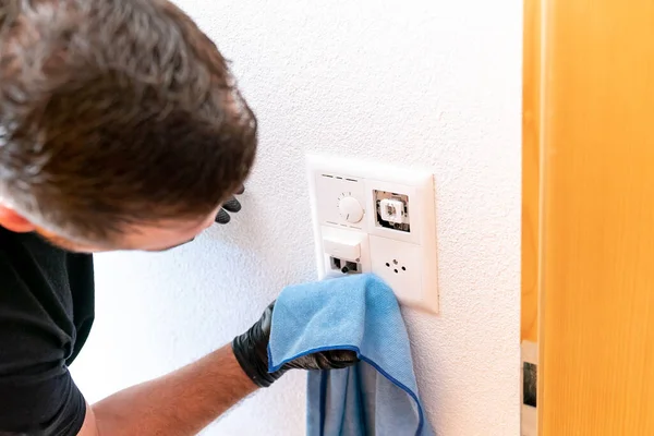 Close Professional Cleaner Cleaning Modern Light Switch Dimmer Socket Micro — Stock Photo, Image
