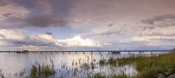 A view of Lake Constance with the pier at Altnau in evening light