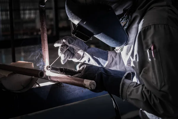Welding steel pipe with Mig-Mag method for industrial work. Gas metal arc welding