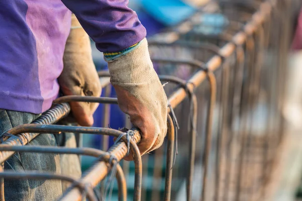 Using steel wire for securing steel bars with wire rod for reinforcement of concrete or cement. focus to activity work.