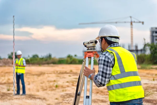 Surveyor equipment. Surveyors telescope at the construction site or Surveying for making contour plans are a graphical representation of the lay of the land before startup construction work