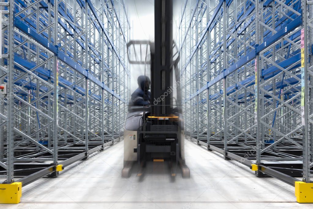 Refrigeration and freezing warehouse with stacker truck inside moving