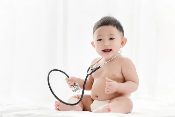Asian Baby Boy Smiling Plays Stethoscope Bed White Background Healthcare — Stock Photo, Image