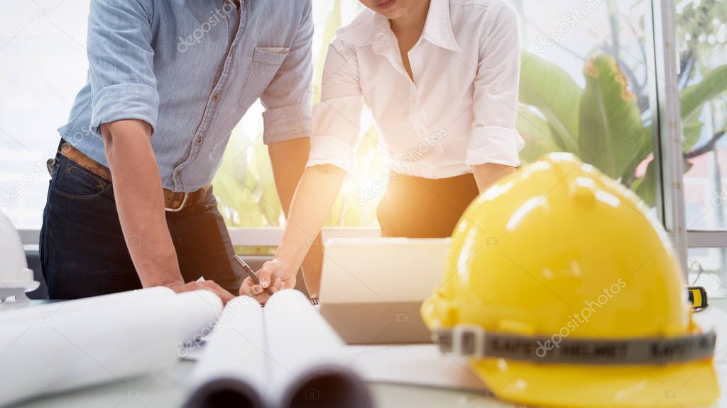 Engineer Designer People Drawing and Planning with Blueprint Architecture on Desk office. Drafting and Design Worksheets Before Startup Project Concept.