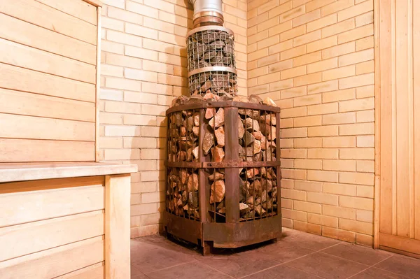 Old oven and stones in the interior of the sauna. close-up