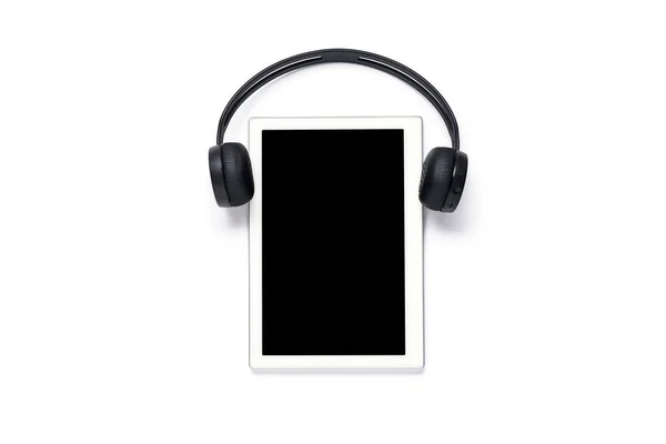Tablet with wireless headphones on a white background, concept of modern education, technology — Stock Photo, Image