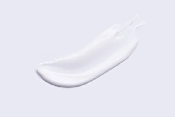 白い背景に白いクリームスミア トップビュー セルフケアの概念 — ストック写真