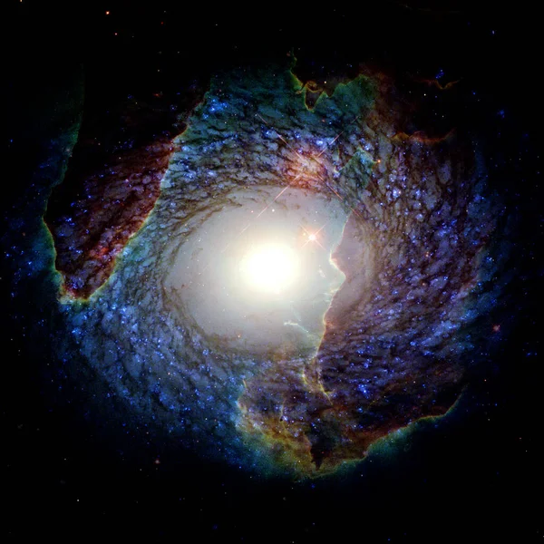 Spiral nebula and light ray in deep space. Elements of this image furnished by NASA.