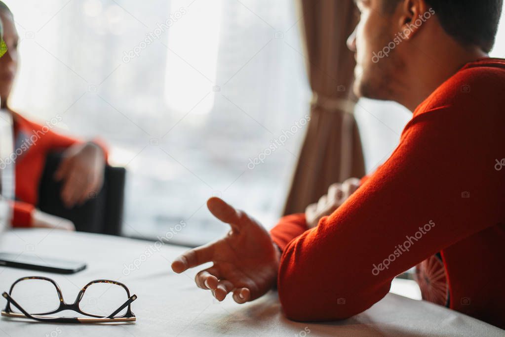 close up of man sitting at table 