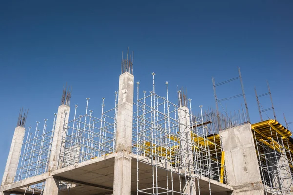 metal concrete structures of the building under construction. scaffolding and supports. bottom view