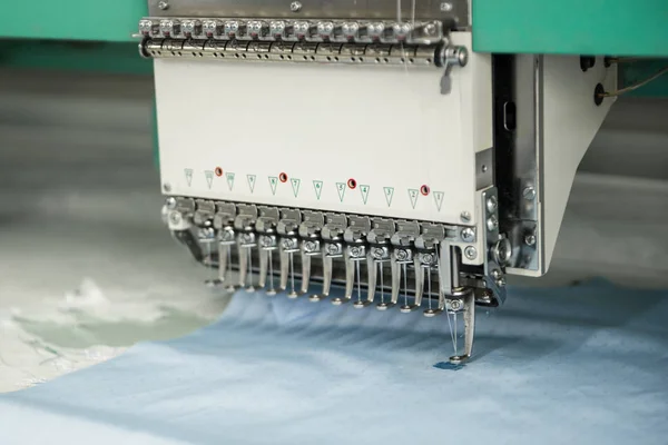 professional sewing machine for logo and emblem embroidery, close-up