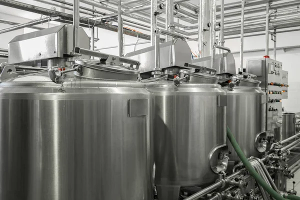 storage and pasteurization tank at the milk factory. equipment at the dairy plant