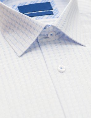 shirt with checkered pattern and with a focus on the collar and button, close-up clipart