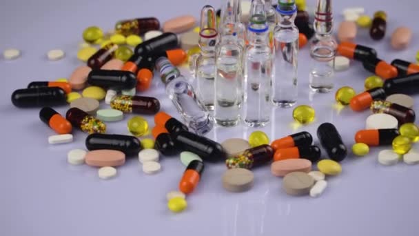 Multicolored Medical Pills Capsules Move Light Background Close — Stock Video