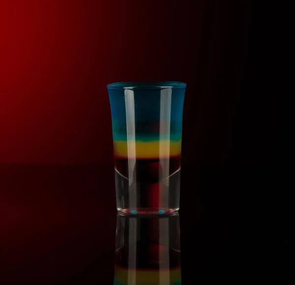 Shot glass with alcohol on a dark background — Stock Photo, Image