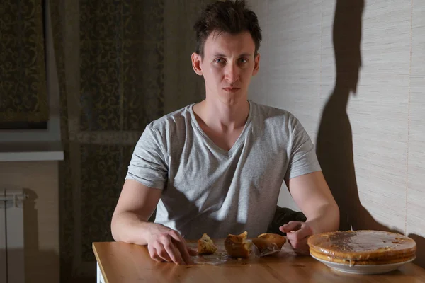 Young Man Eats Sweets Kitchen Night — Stock Photo, Image