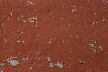 kırmızı duvar arka plan solmuş boya ile. Eski sıva doku.