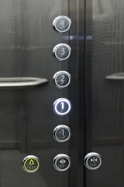 Interior and closeup of metal buttons in elevator — Stock Photo, Image