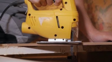 Man working with jig saw