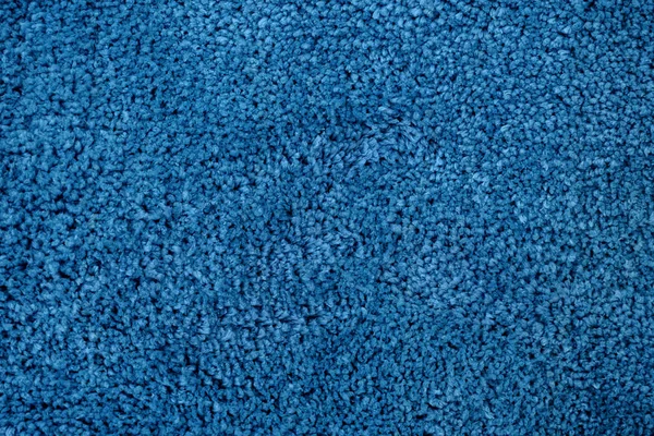Крупный план синей искусственной текстуры ткани — стоковое фото